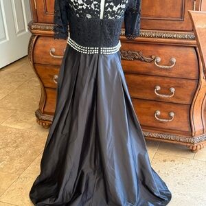 Elegant Black and White Gown with Pearl Accents